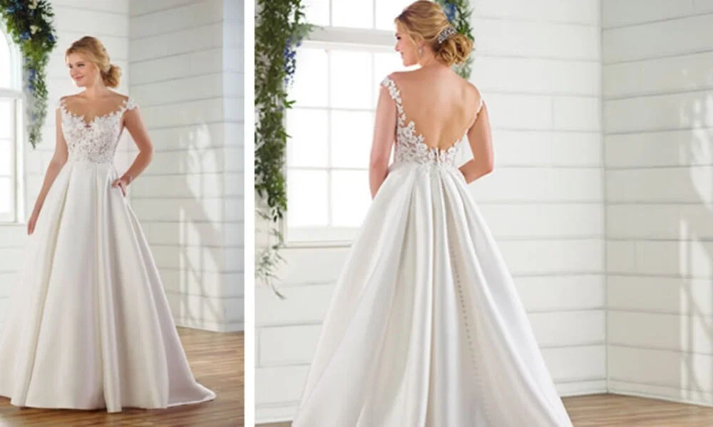 Detailreiches Brautkleid mit Spitze und weit ausgestelltem Rock. Das Kleid hat einen tiefen Rückenausschnitt, der in einer langen Knopfleiste endet.