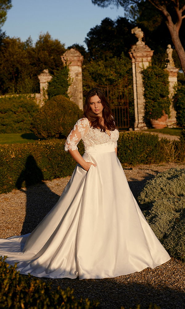 Schlichtes A-Linien-Kleid mit romantischen Spitzendetails und praktischen Taschen für einen modernen Touch.