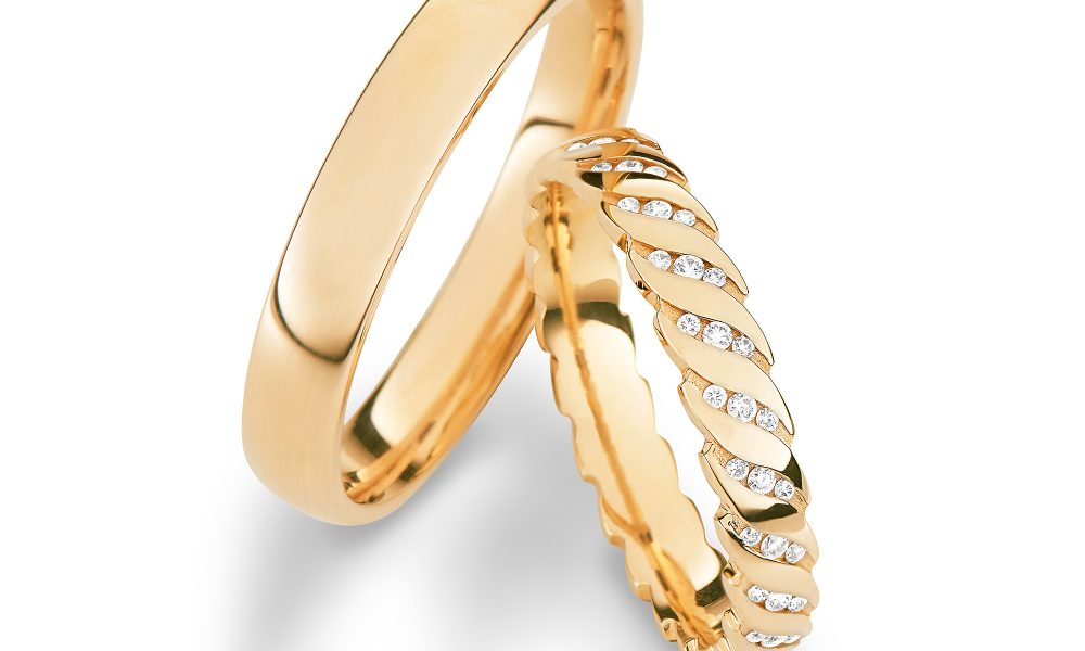Romantisches Ringpaar von Max Kemper mit floralem Brillantschliff im Damenring.