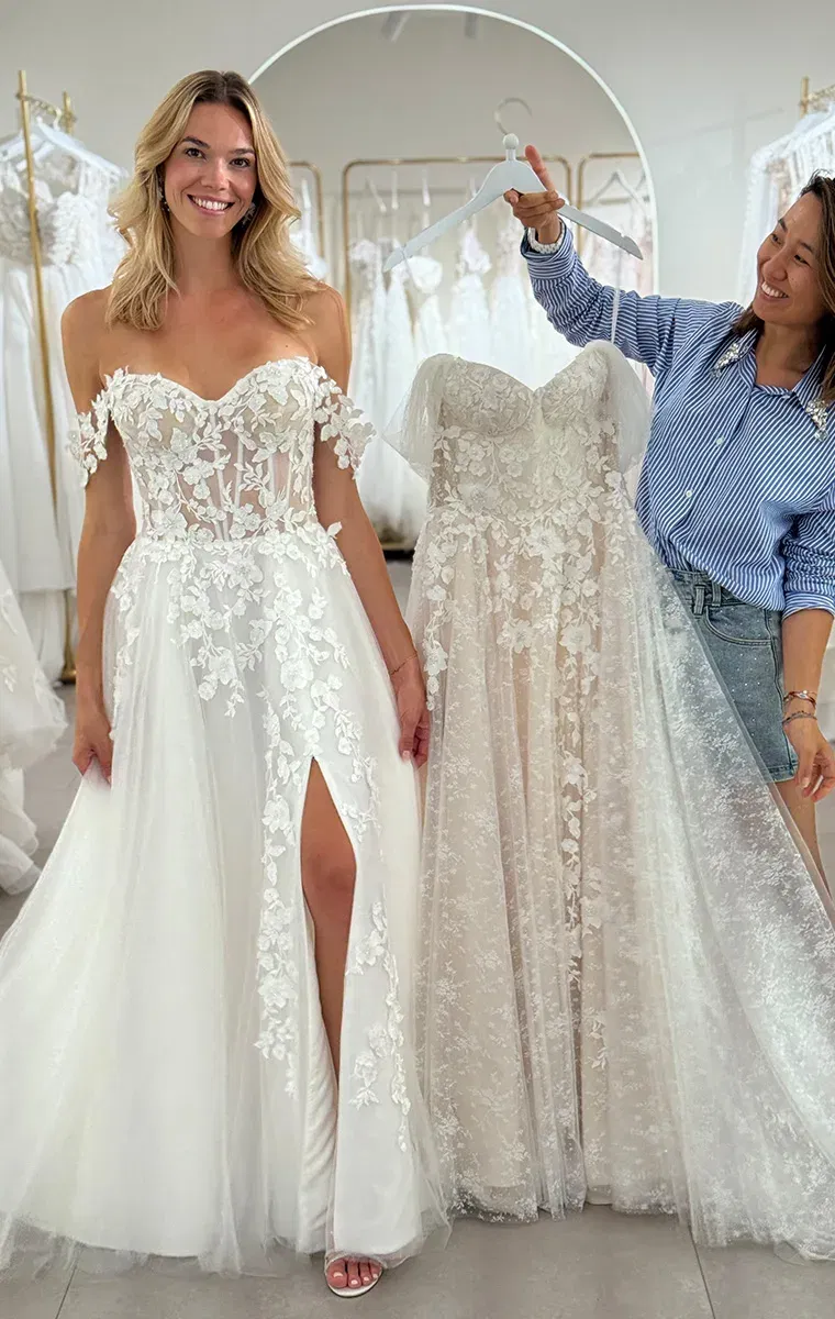 Braut beim Anprobieren eines individuell angepassten Casablanca Brautkleids im Store White Silhouette München.